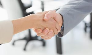 Close-up of shaking hands after a business meeting in the office