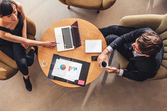 businesswoman-meeting-with-businessman-at-office-lobby